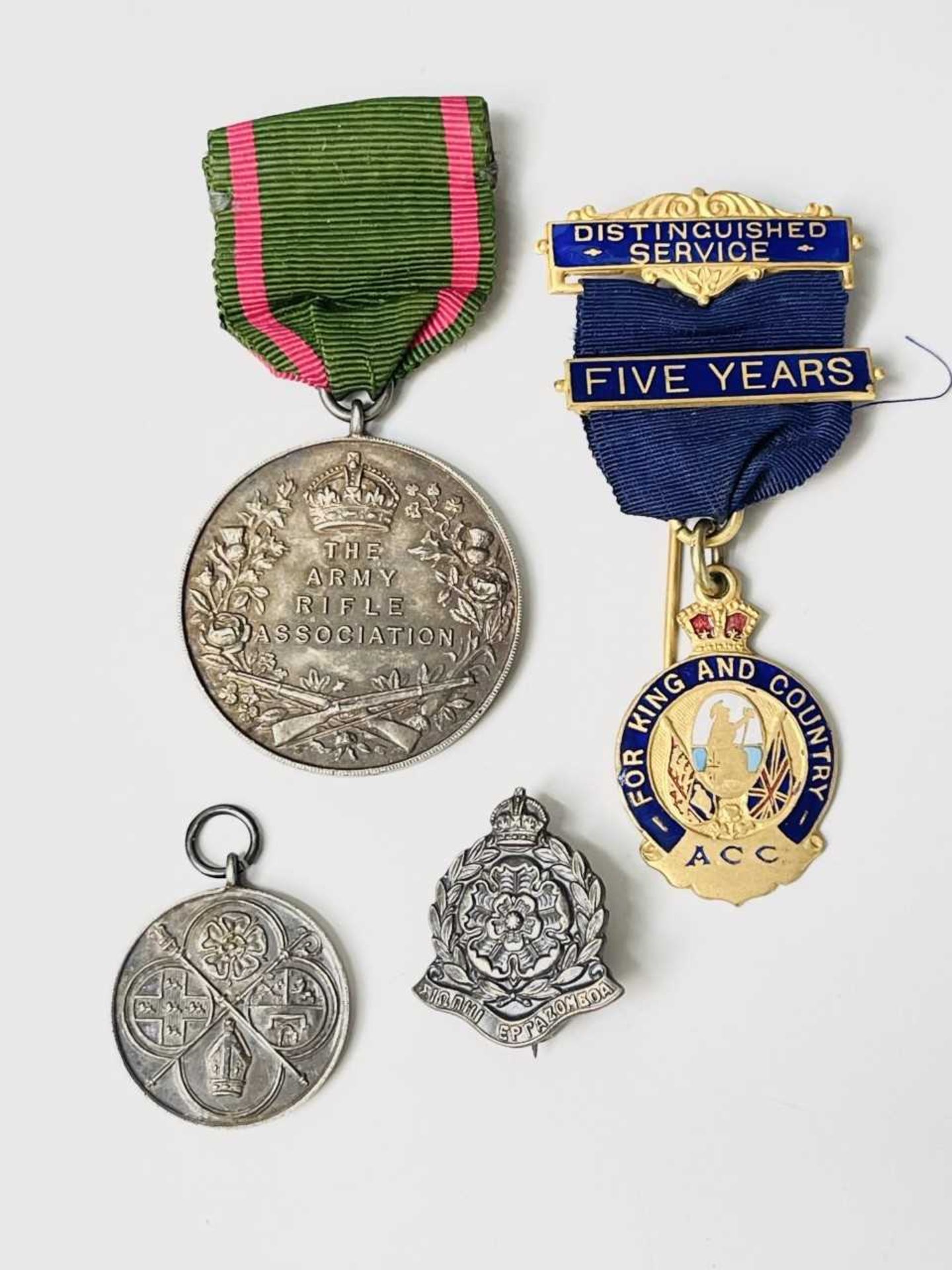 Military and other Medals and Badges. A hallmarked silver Army Rifle Association medal, an A.C.C. "