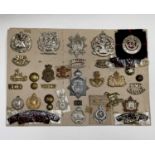 Canadian Scottish and Armoured Cavalry. A display card containing cap badges, shoulder titles and