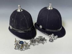 Police Helmet x 2. Plus Devon and Cornwall plastic helmet plates x 2, Devon and Cornwall cap