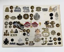 East Africa / British Colonies. A display card containing cap badges, collar dogs, shoulder titles