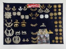 Scottish and English Regiments (68th to 79th Foot). A display card containing cap badges, collar