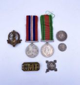 Medals, badges & coins Lots comprises a World War 2 Defence Medal & War Medal, a "CMP" shoulder