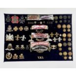 English Regiments. A display card containing cap badges, collar dogs, shoulder titles and buttons.