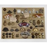 Australian Regiments. A display card containing cap badges, collar dogs, shoulder titles and