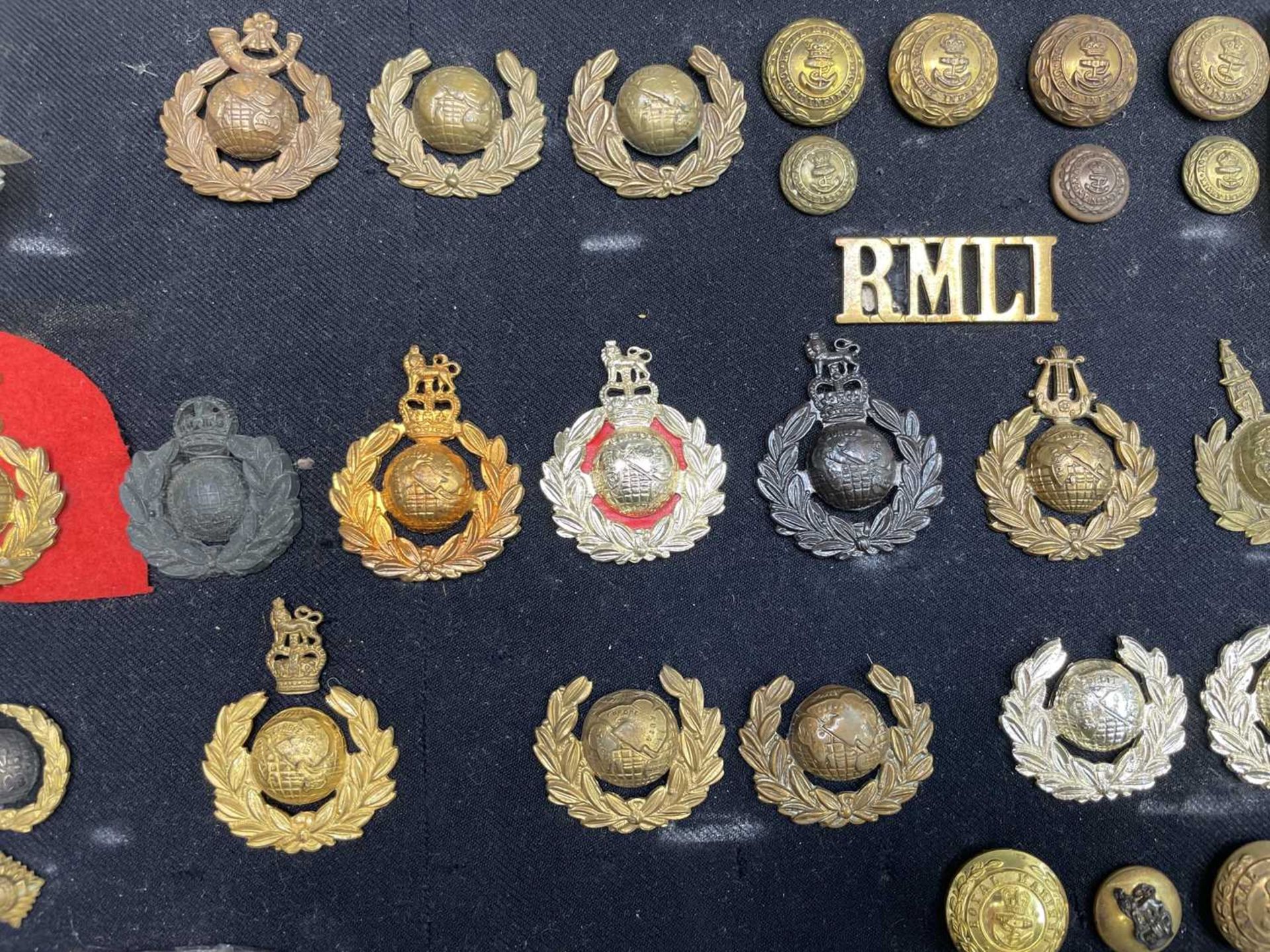 Royal Marines - 1. A cloth display of cap badges, collar dogs, shoulder titles and buttons. A - Image 3 of 4