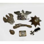 German Militaria. A small box containing mainly 1st World War German badges, etc. Lot includes an