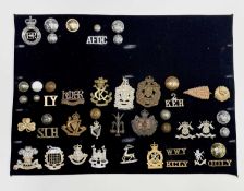 Miscellaneous - 1. A display card containing cap badges, collar dogs, shoulder titles and buttons.