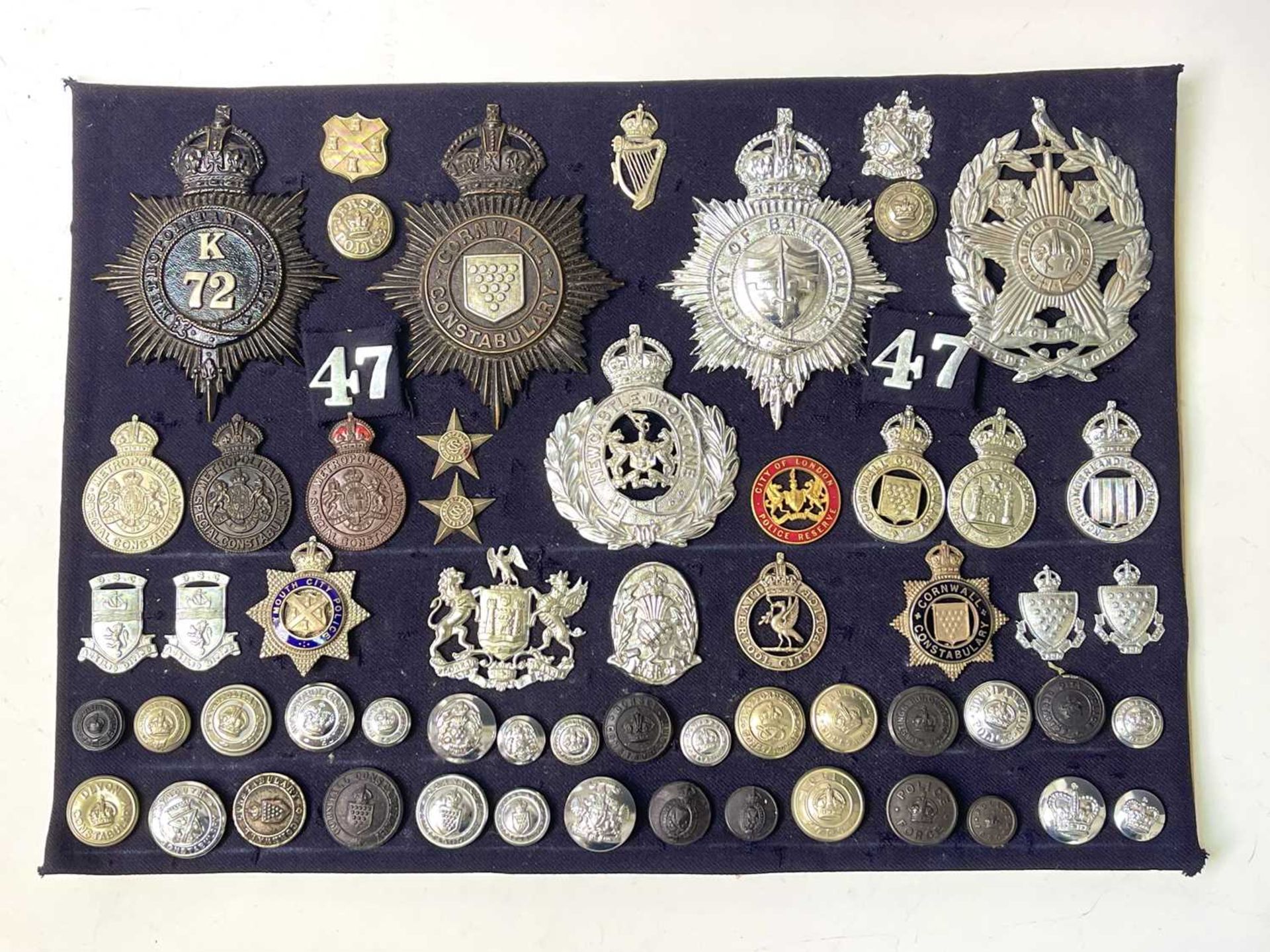 British Police Force Badges. A display card of badges, buttons and collar dogs including helmet