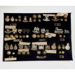 Dragoons - 2. A display card containing cap badges, collar dogs and buttons. Noted: 5th, 6th & 7th