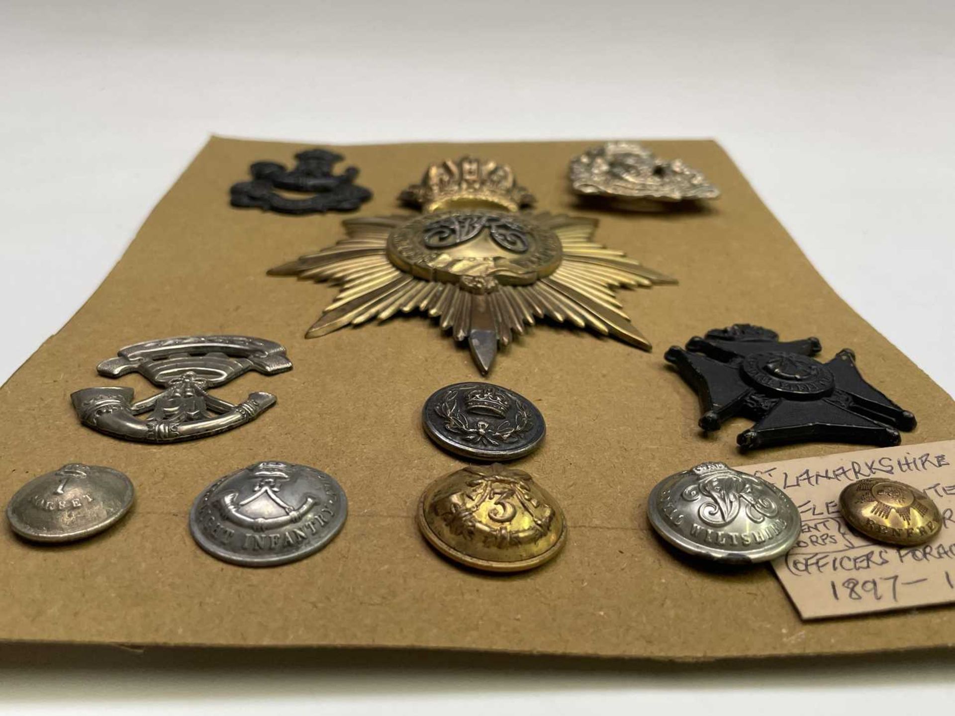 Shako Plate, Cap Badges and Buttons. A mainly 19th century card including South Devon Regiment of - Image 7 of 8