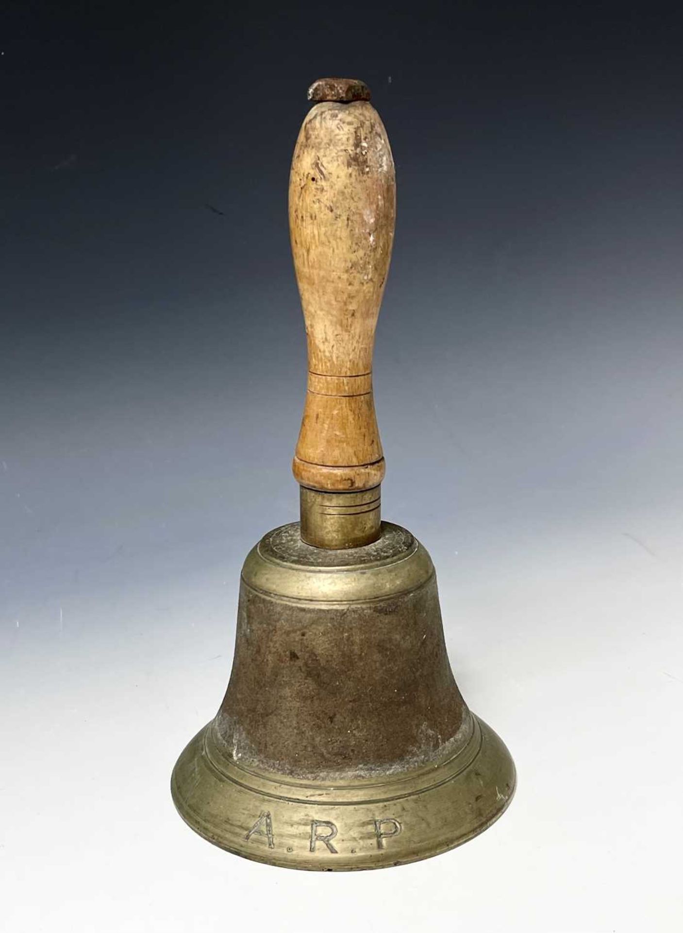 World War Two Air Raid Patrol Hand Bell. A wooden handled brass bell height 10". Condition: please