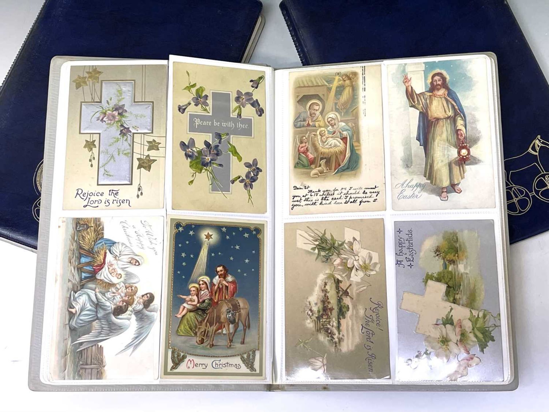 Postcards Collections of lambs, swans and greetings contained in three albums, many real