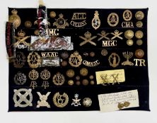 Disbanded Units. A display card containing cap badges, collar dogs, shoulder titles and buttons.