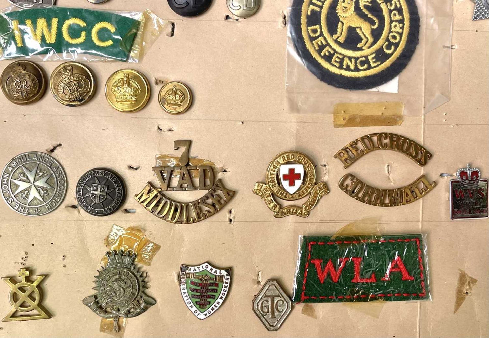 Military Auxiliary Services. A display card of badges, buttons, etc. Noted: On War Service, On War - Image 3 of 5