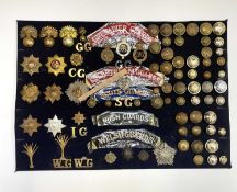 Guards Regiments. A display card containing cap badges, collar dogs, shoulder titles and buttons.