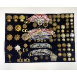 Guards Regiments. A display card containing cap badges, collar dogs, shoulder titles and buttons.