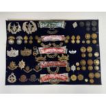 English and Scottish Regiments - 26th-30th Foot. A display card containing cap badges, collar