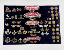 English Regiments - 49th-57th Foot. A display card containing cap badges, collar dogs, shoulder