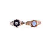 A Victorian yellow gold and enamel mourning ring, inset with a diamond surrounded with black enamel,