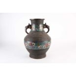 A Chinese bronze and champleve enamel vase, early 20th century, with bixi mask and tongue handles,