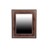 A 19th century style French wall mirror, the ebonised frame with gilt scroll decoration, 65.5cm x