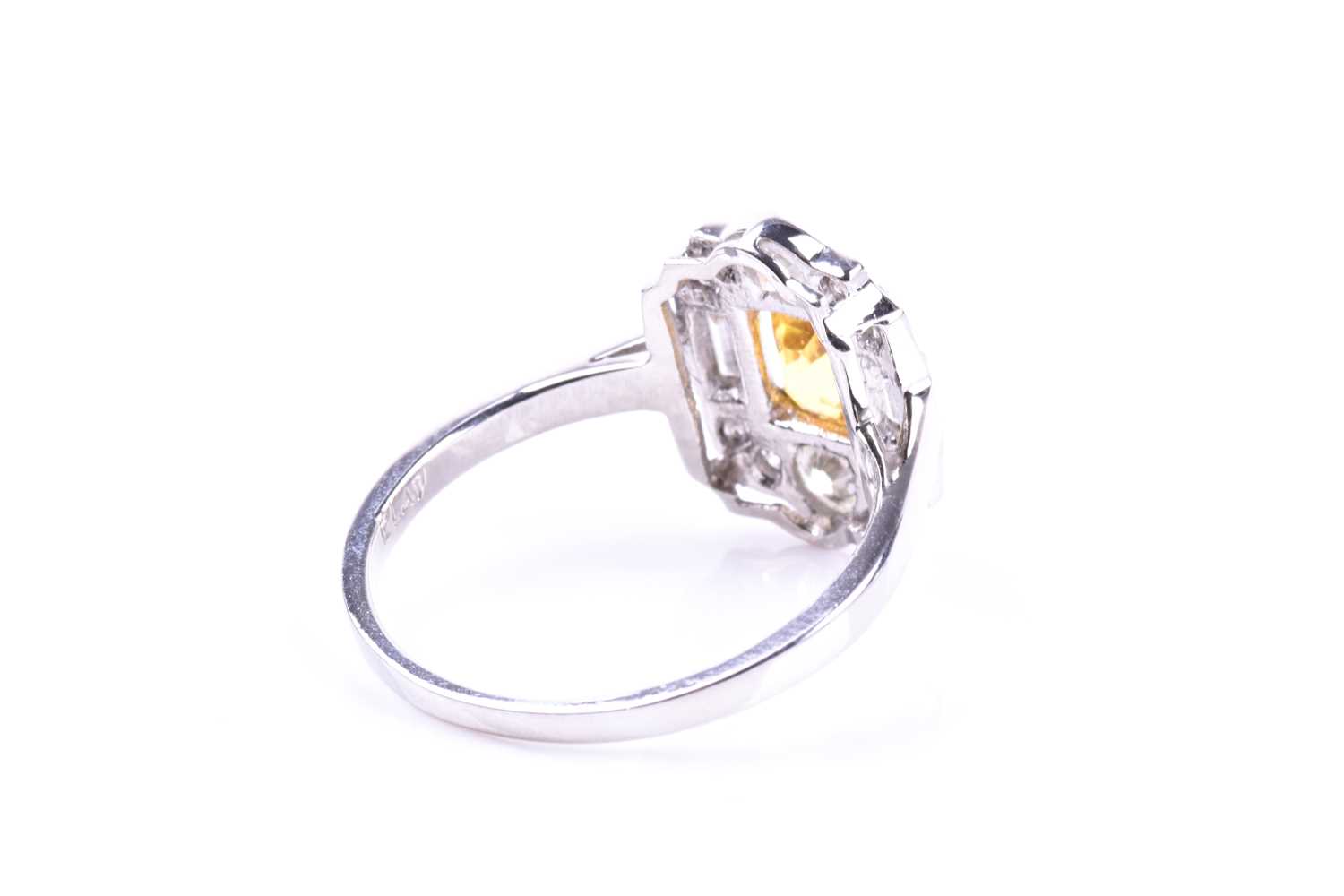 A platinum, diamond, and yellow sapphire ring, in the Art Deco style, set with a mixed-cut - Image 4 of 5