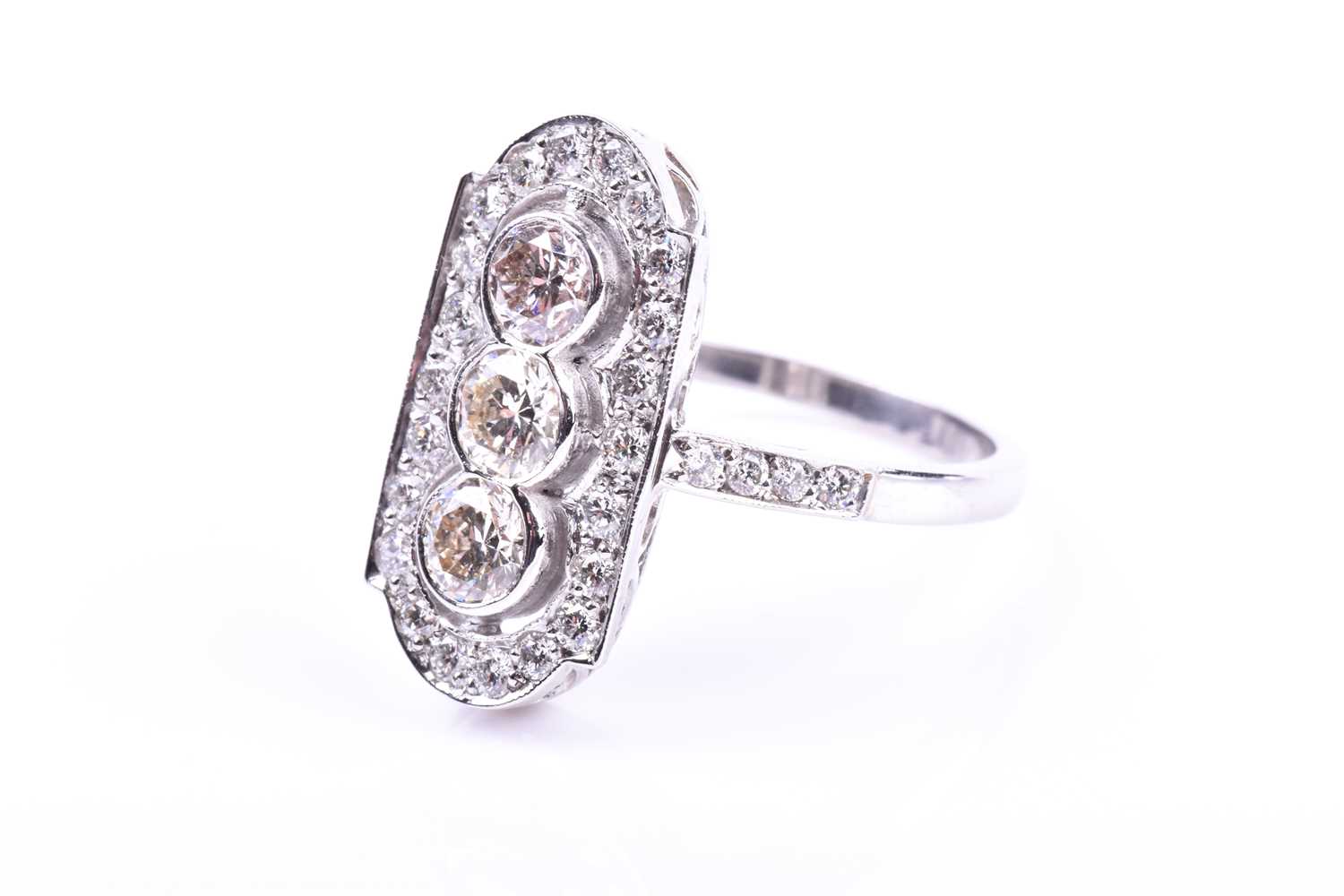 A platinum and diamond ring, in the Art Deco style, the lozenge-shaped plaque ring inset with - Image 5 of 5