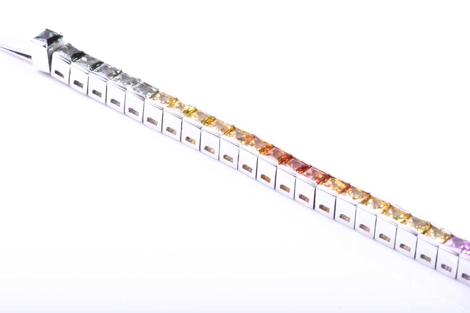 An 18ct white gold and rainbow sapphire bracelet, set with multi-coloured sapphires ranging from - Image 4 of 9