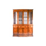 A reproduction Georgian style walnut breakfront display cabinet, the glazed upper section with glass