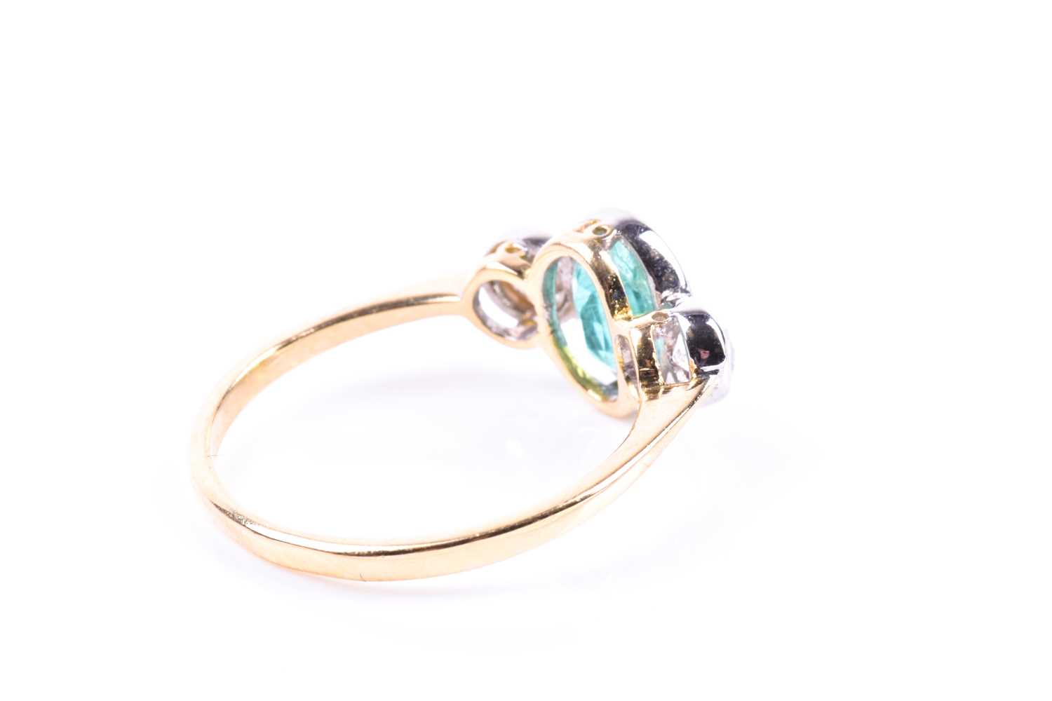 An 18ct yellow gold, diamond, and emerald ring, collet-set with a mixed oval-cut emerald of - Image 2 of 5