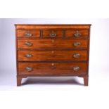 A late Georgian mahogany chest of drawers, early 19th century, the top with ebony stringing, above