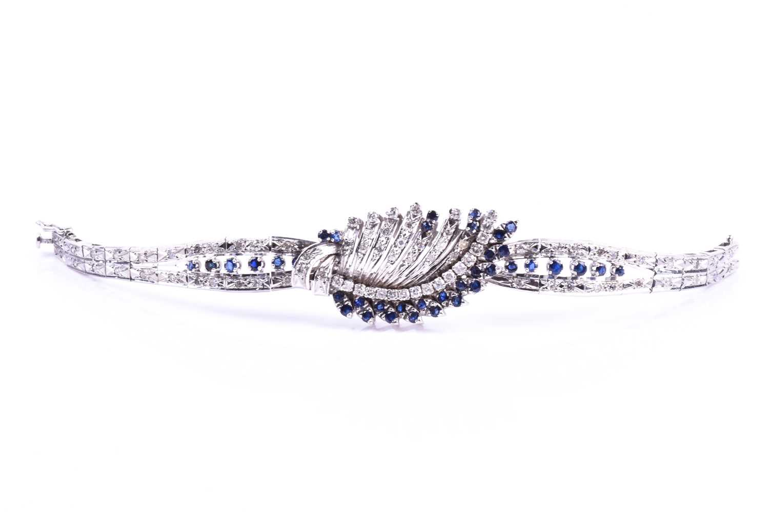 A white metal, diamond, and sapphire bracelet, the swept central segment set with round brilliant- - Image 4 of 5