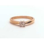 An 18ct yellow gold ring, set with a single princess-cut diamond of approximately 0.20 carats,