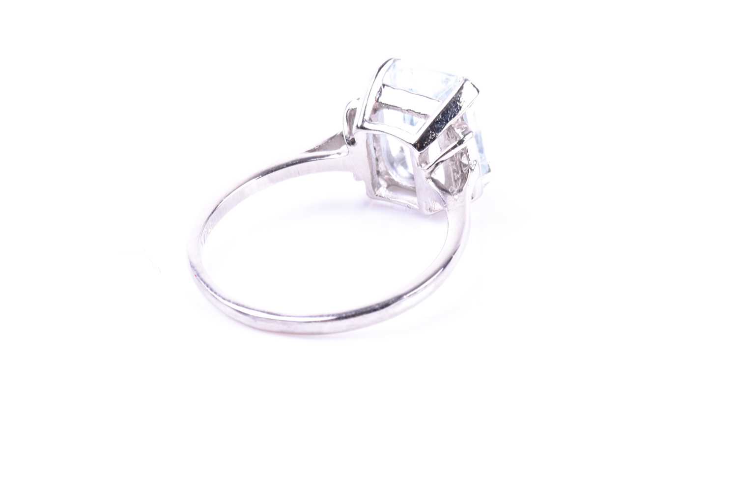 A platinum, diamond, and aquamarine ring, set with an emerald-cut aquamarine of approximately 2.55 - Image 4 of 6