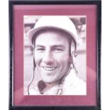 Sir Stirling Moss (1929-2020), a signed black and white portrait photograph, the signature to