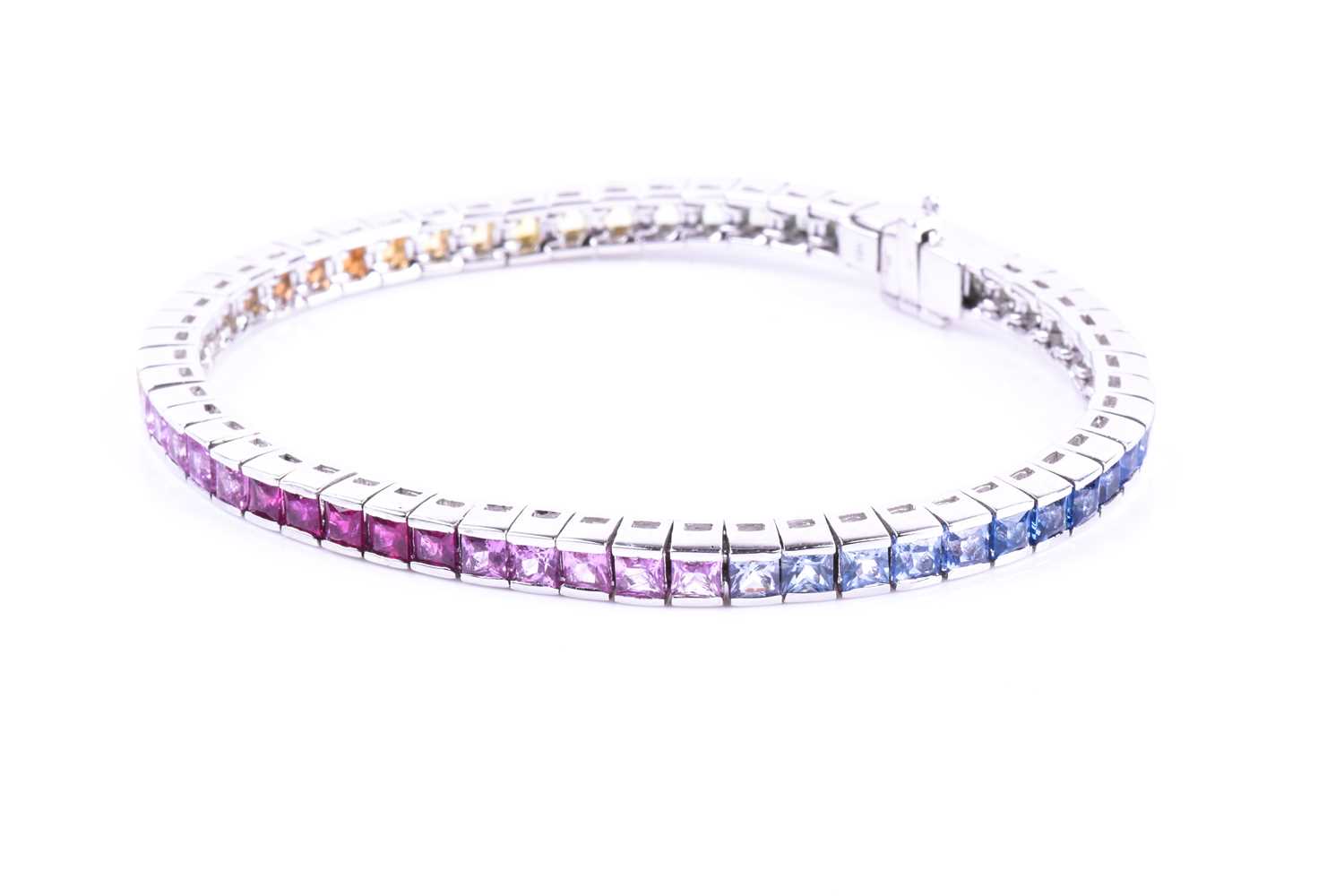 An 18ct white gold and rainbow sapphire bracelet, set with multi-coloured sapphires ranging from - Image 9 of 9