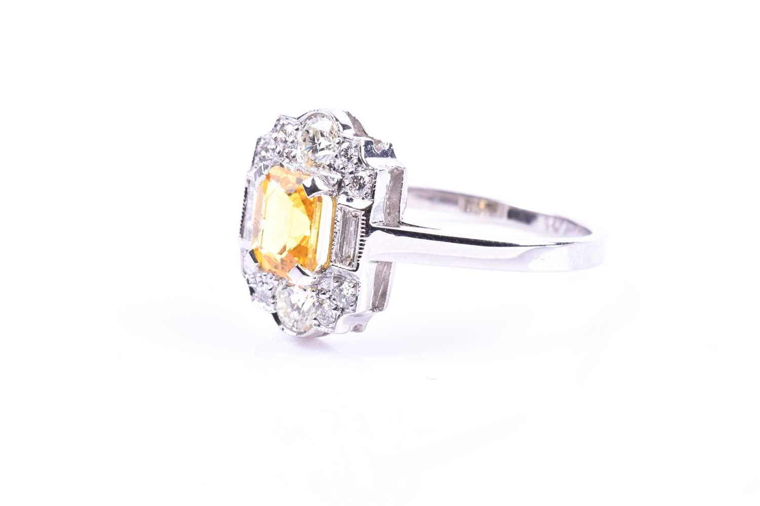 A platinum, diamond, and yellow sapphire ring, in the Art Deco style, set with a mixed-cut - Image 5 of 5