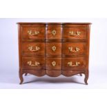 A French walnut chest of three long drawers, 19th century, the shaped drawer fronts with drawers