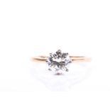 An 18ct yellow gold and solitaire diamond ring, set with a round brilliant-cut diamond of