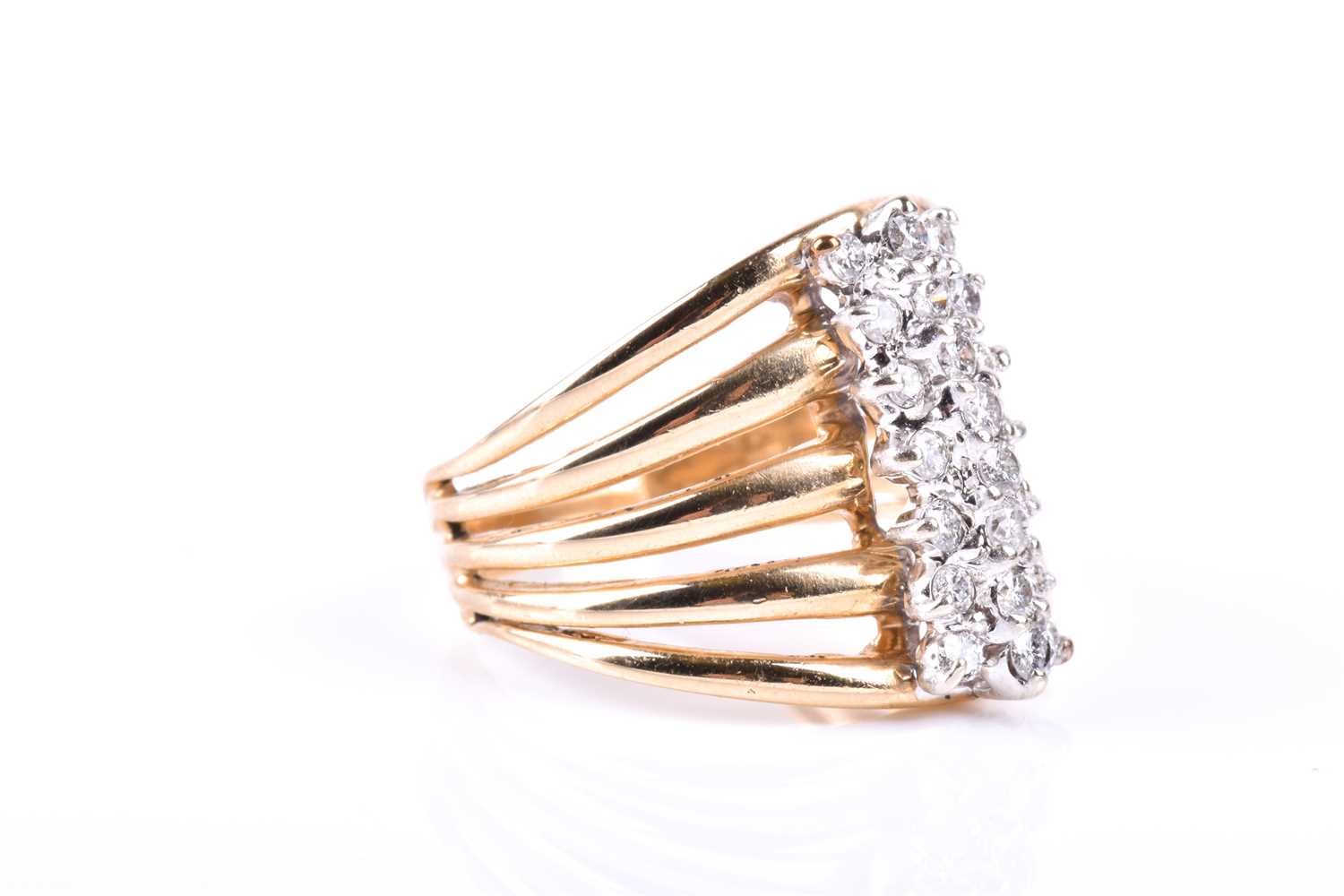 A yellow metal and diamond dress ring, the five-bar split shank centred with a triple row of round - Image 2 of 3