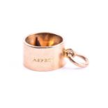 Asprey & Co. An unusual novelty 9ct yellow gold pendant in the form of a small cigar cutter, 12 mm