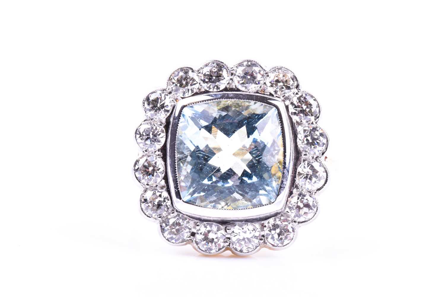 An 18ct yellow gold, diamond, and aquamarine ring, set with a mixed cushion-cut aquamarine of