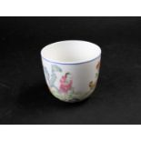 A Chinese porcelain 'Chicken' wine cup, painted with a figure holding corn with chickens and