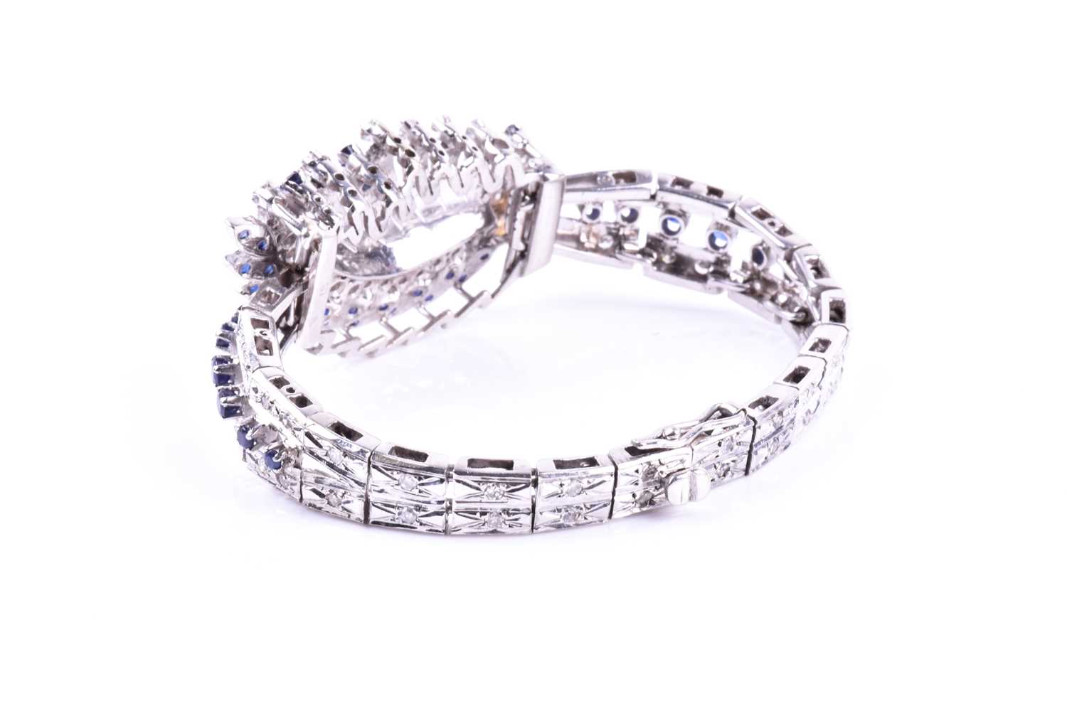 A white metal, diamond, and sapphire bracelet, the swept central segment set with round brilliant- - Image 5 of 5