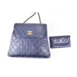 Chanel. A classic quilted leather handbag, of tapered square design, with gold tone CC logo clasp,
