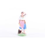 A 19th century Russian Gardner Porcelain figure, 'Ukranian Peasant Girl', decorated in polychrome