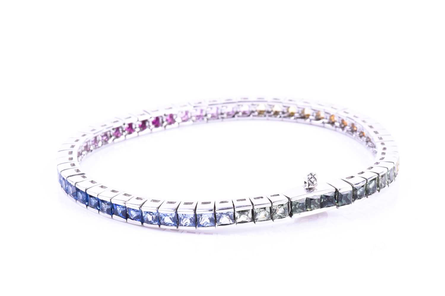 An 18ct white gold and rainbow sapphire bracelet, set with multi-coloured sapphires ranging from - Image 8 of 9