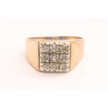 A 9ct yellow gold and cubic zirconia gents ring, set with nine round-cut CZs, size S, 5.5 grams.