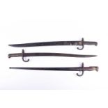 Two French Model 1866 Yataghan Chassepot bayonet, one with engraved back 'Mre Imple de St Etienne