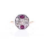 An Art Deco diamond and ruby ring, the octagonal mount set with round-cut diamonds and two round-cut